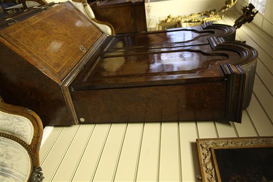 A Queen Anne walnut and featherbanded bureau cabinet, W.3ft 5in.